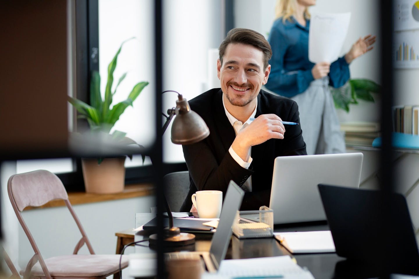 medium-shot-smiley-man-desk_23-2149300656.jpg