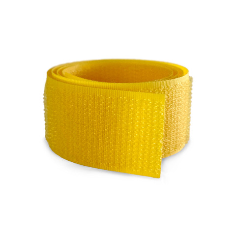 Sewing Yellow Velcro Tape in a Roll Closeup on a Yellow Background