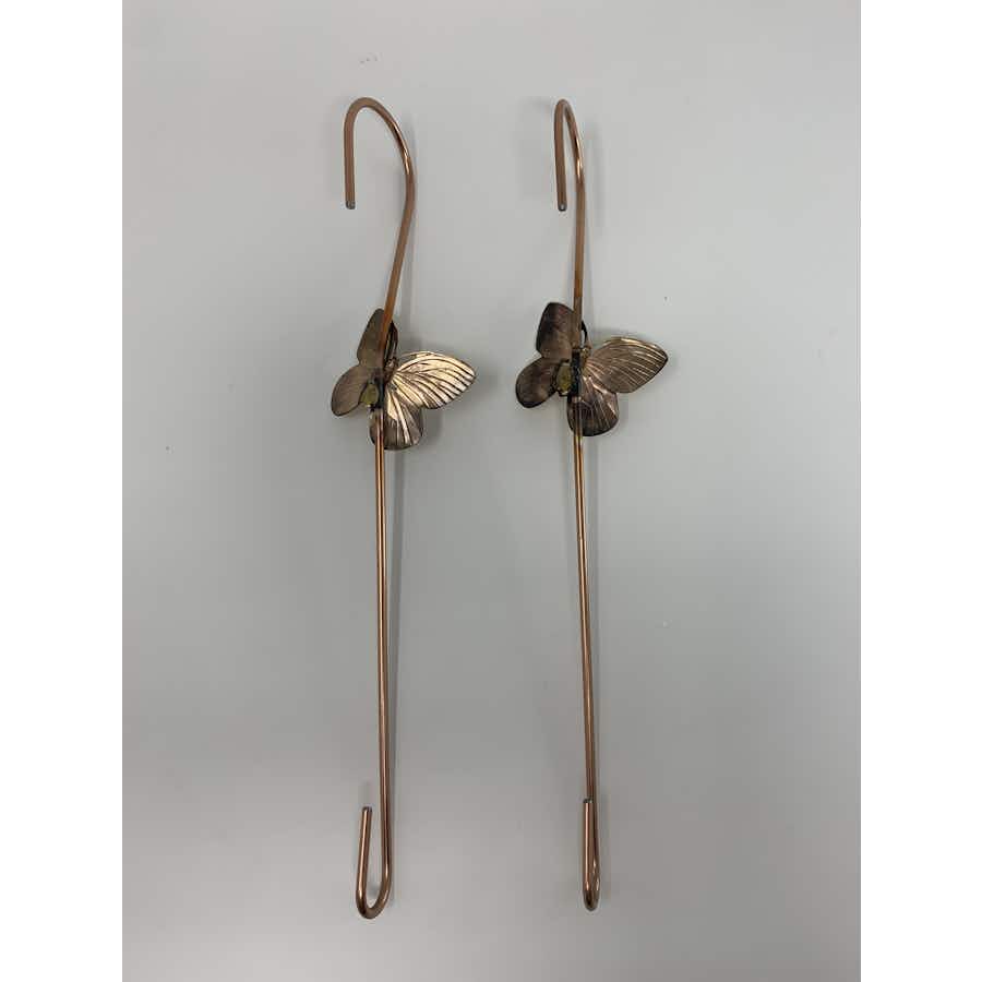The back side of copper coated extension hook with a brass butterfly set of 2