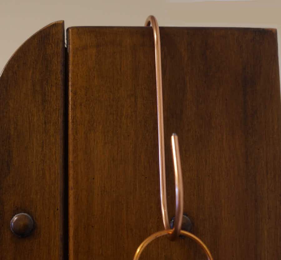 Copper Coated S-Hook hanging on cabinet