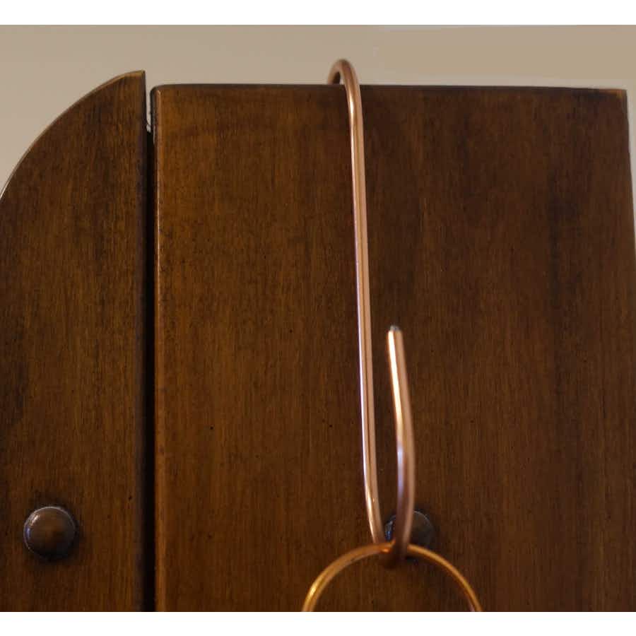 Copper Coated S-Hook hanging on cabinet
