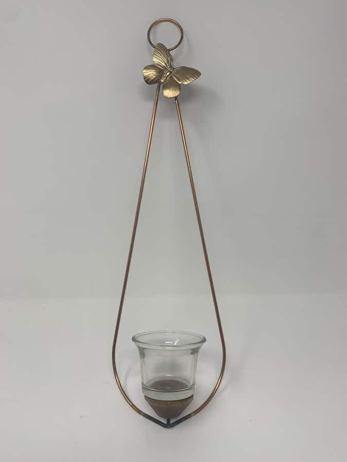 A wall hanging air plant or succulent holder
